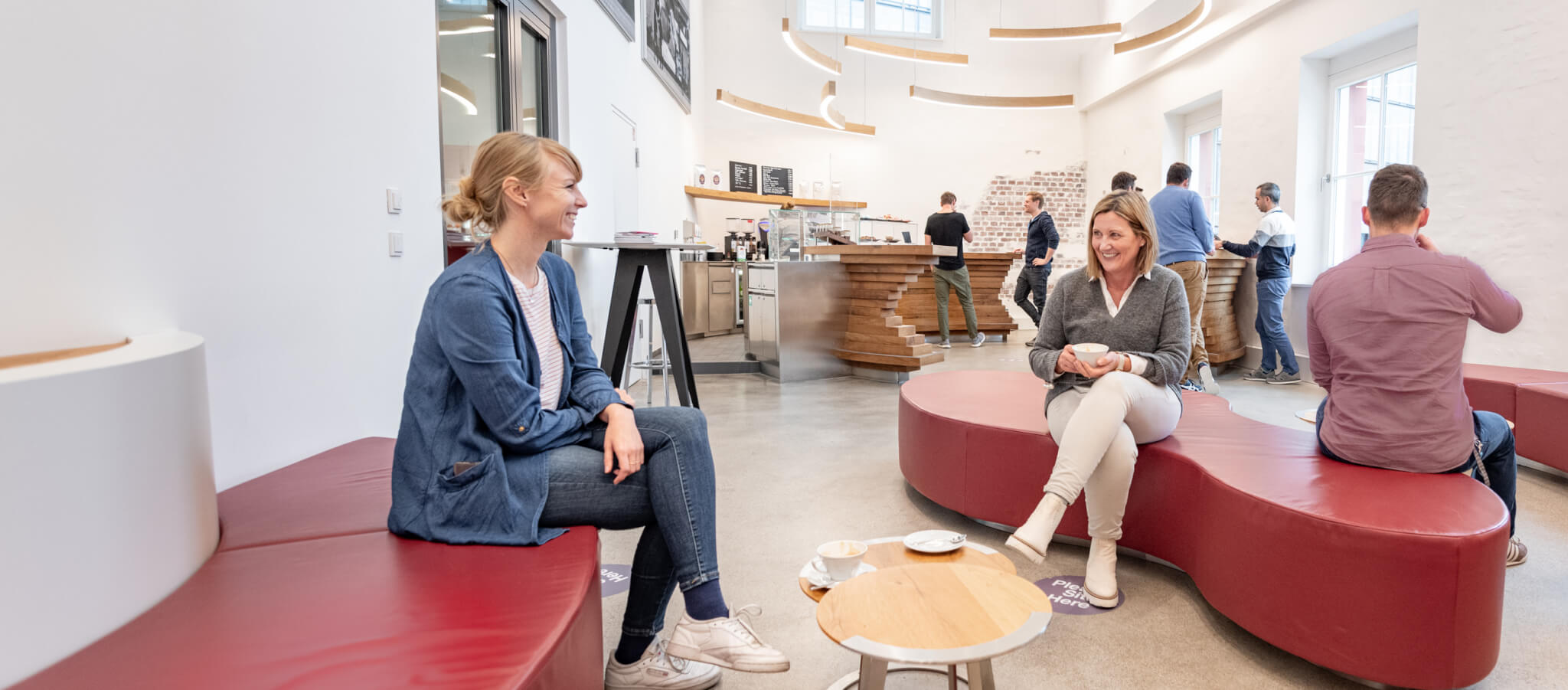 Colleagues chatting and having coffee in the Tower Cafe