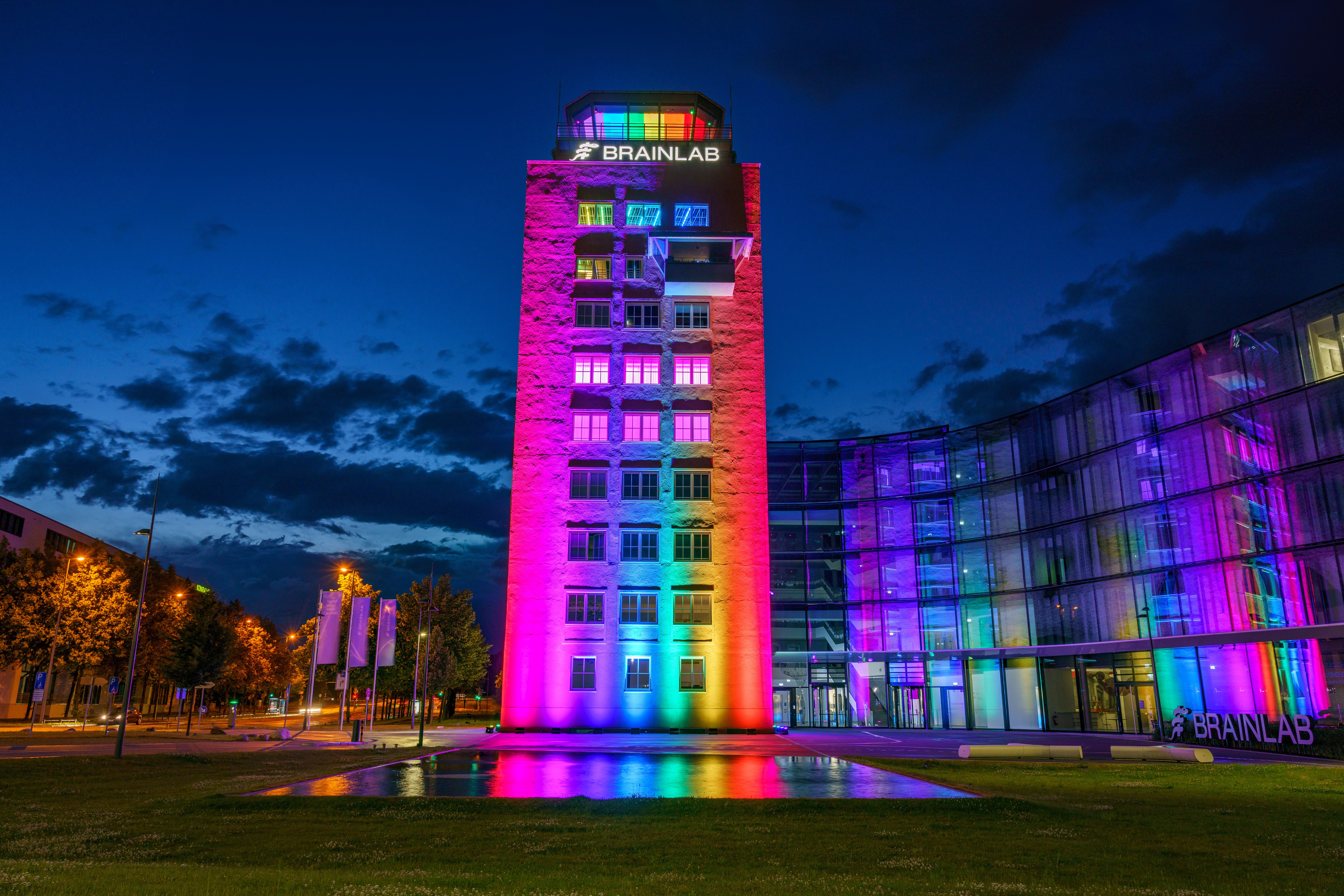 The Brainlab Tower in Munich illuminated in rainbow colors