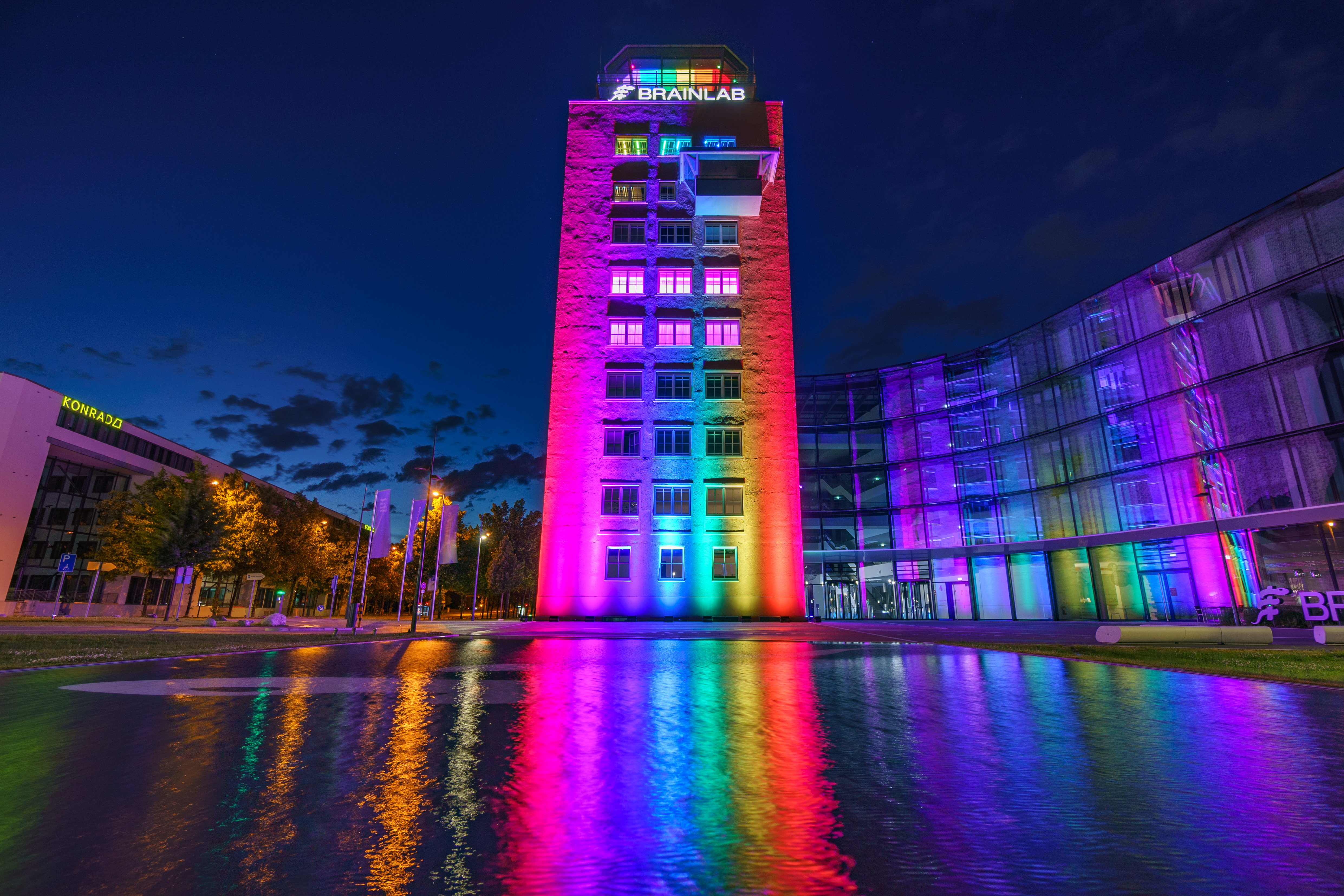 The Brainlab Tower in Munich illuminated in rainbow colors