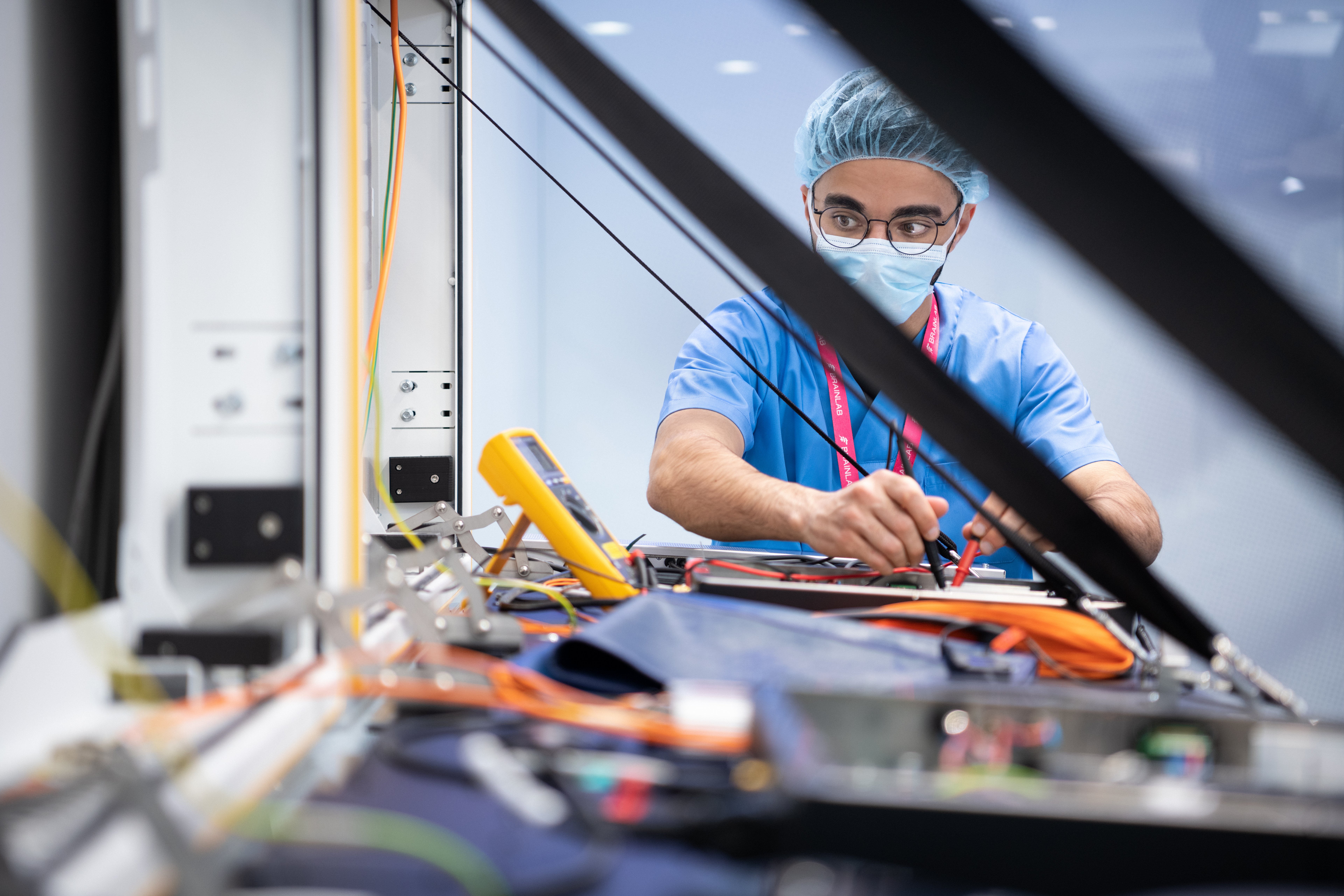 Brainlab service and support employee configuring a Digital O.R. system