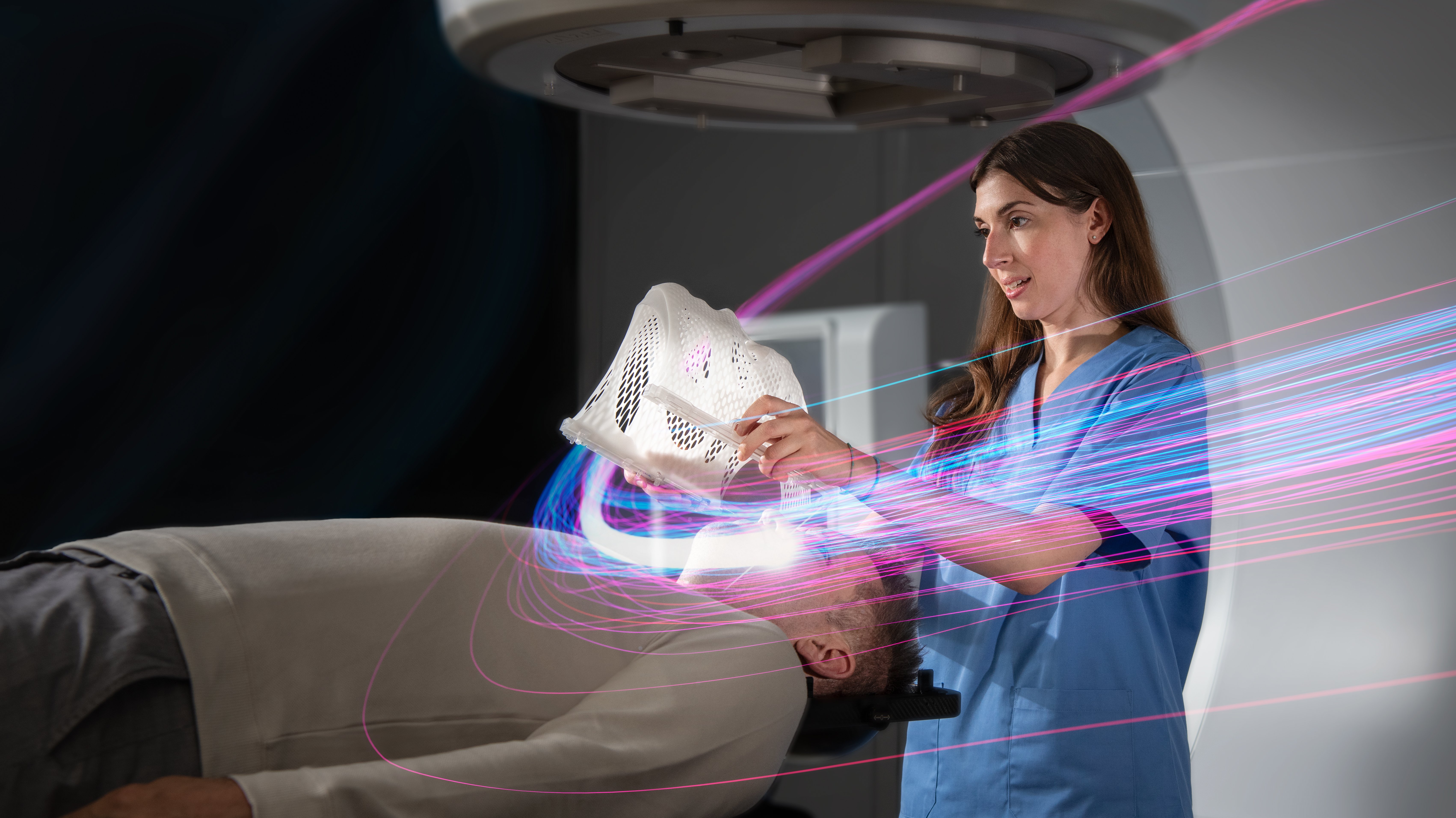 A Brainlab employee demonstrating the use of Brainlab Radiosurgery Technology
