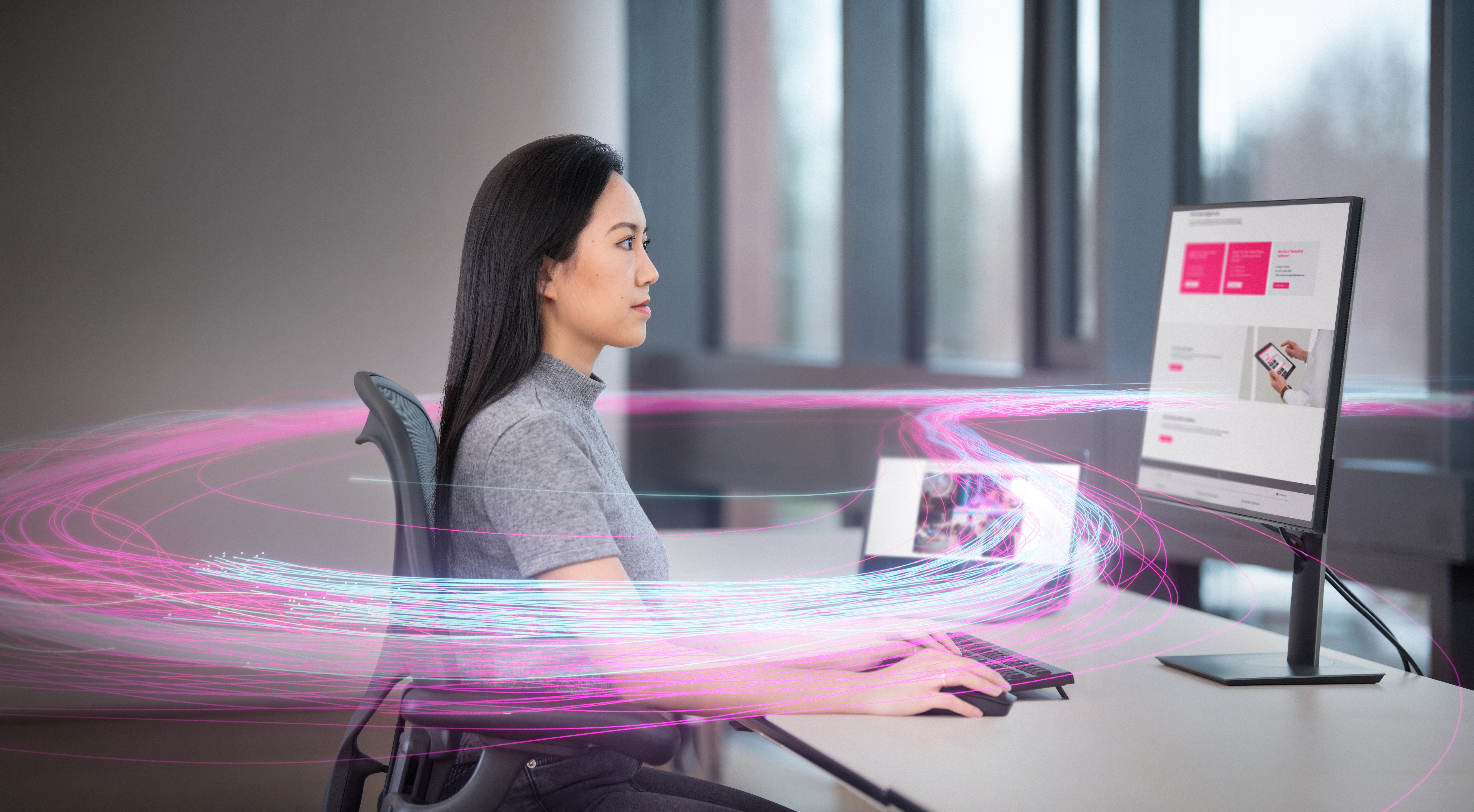 A Brainlab employee is pictured working at the service desk with an added visual effect
