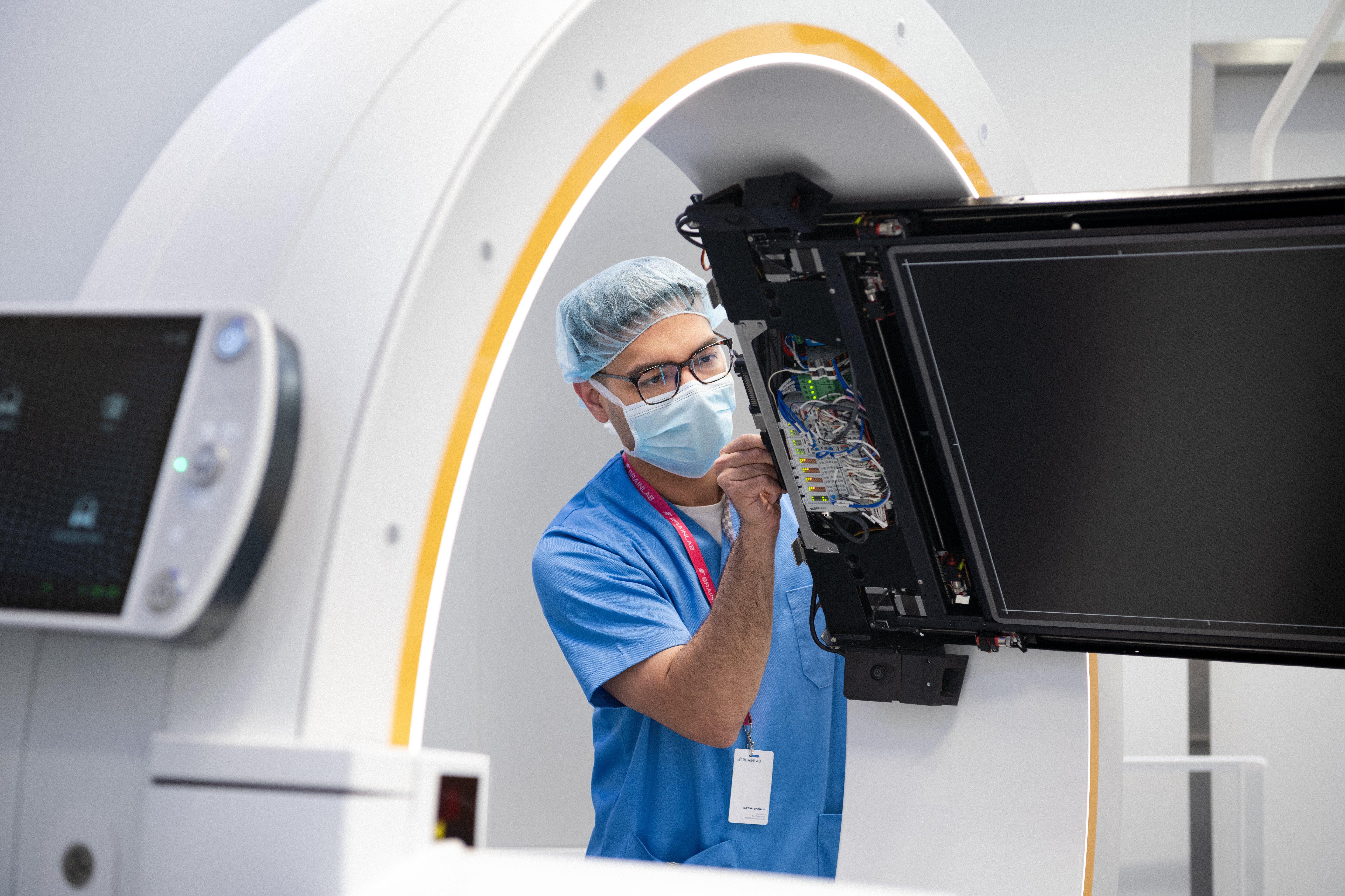 A Brainlab technician installing Loop-X