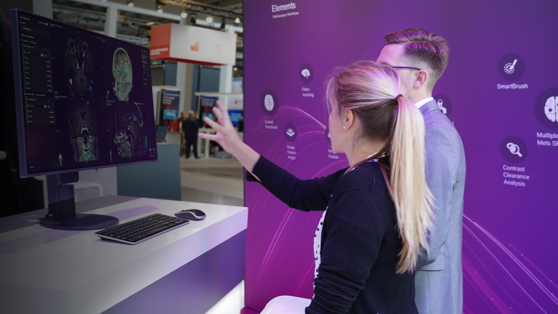 A Brainlab employee demonstrating the Elements software at an event