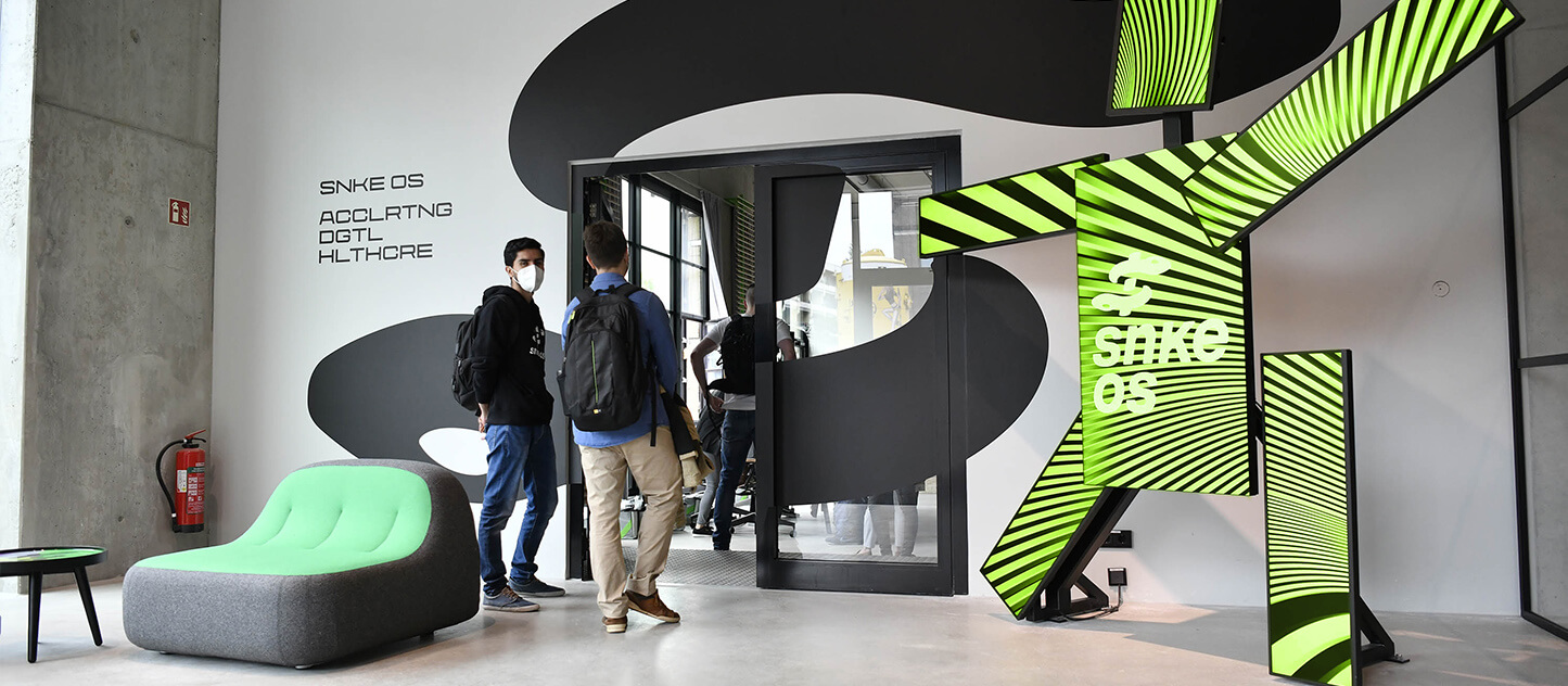 People entering the newly acquired Snke OS and Vision Tree office.